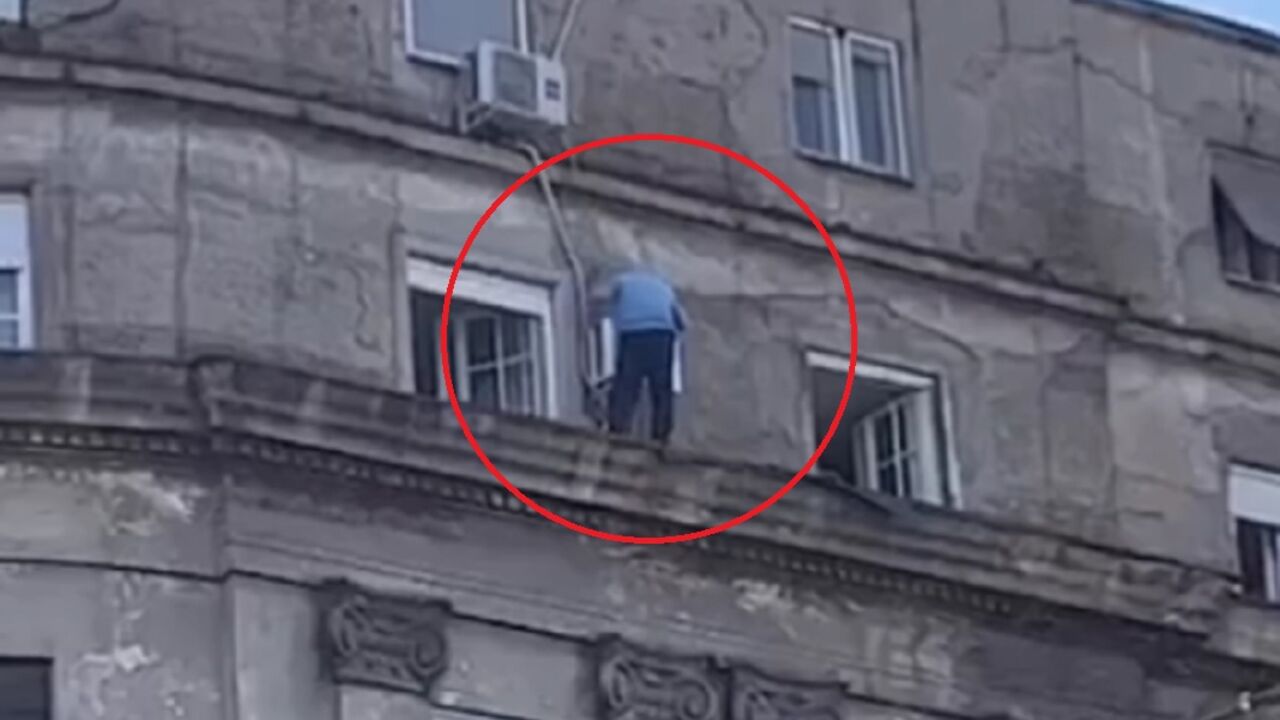 Deka hoda po ivici zgrade